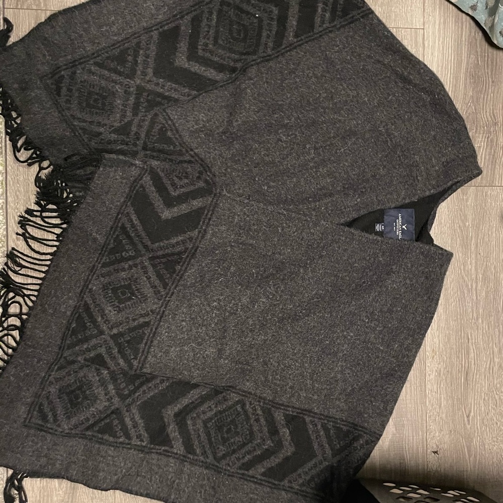 Poncho with tassels